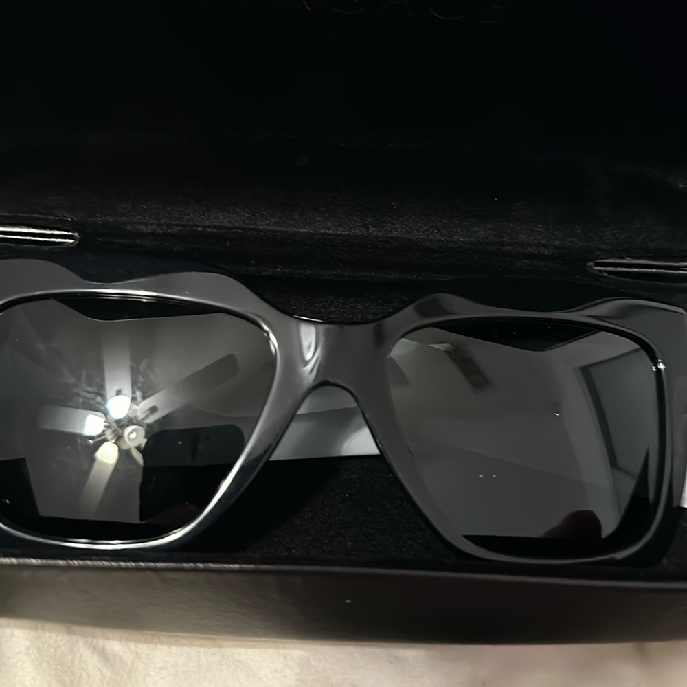 Versace sunglasss new with box, case black with gold details